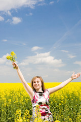 Naklejka premium Happy girl on the rape field.