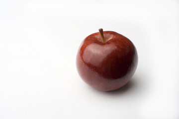 one apple on a white background with shadow