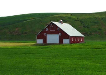 Fototapeta na wymiar Red Barn with Rolling Green Hills