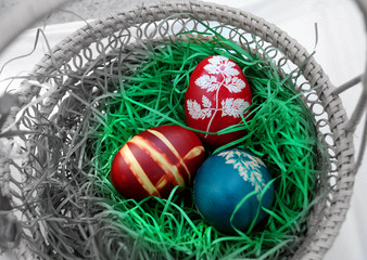 Three easter eggs in basket