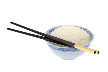 Bowl of cooked rice with chopsticks