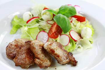 Pork steak with vegetable salad