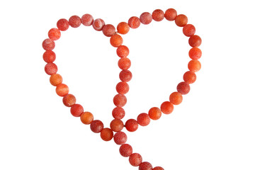 Heart shape made of aate beads isolated on white