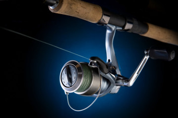 Fishing reel, mounted on a fishing rod