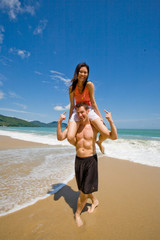 couple playful by the beach