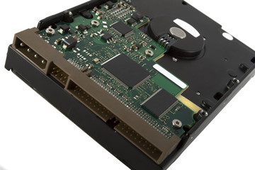 back of an opened hard drive on white background