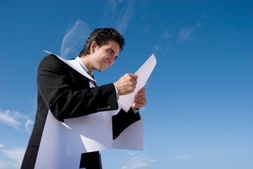 Businessman looking over paperwork
