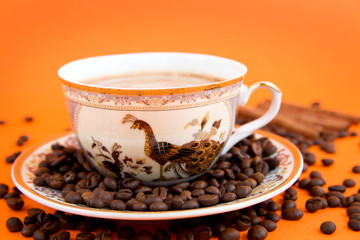 cup of coffee with coffee grain