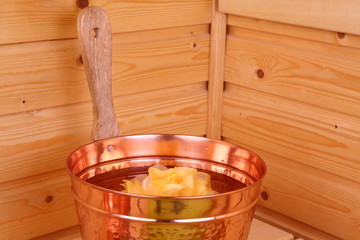 Bucket with water in sauna