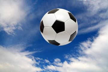 Fototapeta na wymiar football soccer ball under blue sky