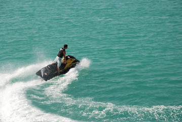 Man Enjoying jetski in deep water.