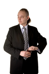 Funny businessman trying to drink alcohol at work