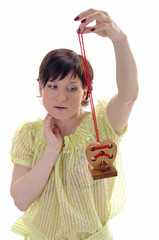 Woman with wooden heart on the branch