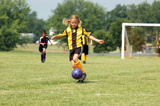 Young Soccer Player Prepares to Kick