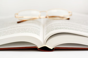 open book with glasses