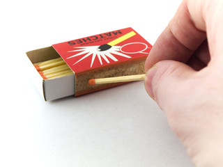Matches in matchbox on white background