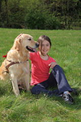 Girl with dog on meadow