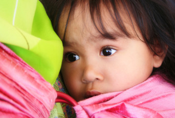 Little girl in a sling