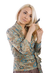 Obraz premium Young blondie girl combing