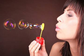 girl blowing blow bubbles - seifenblasen