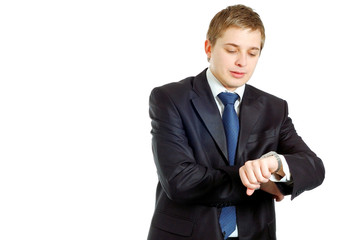 handsome businessman checking his wrist-watch