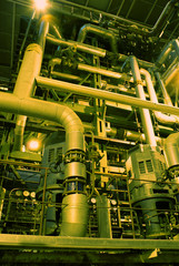 Equipment, cables and piping as found inside of a modern industr
