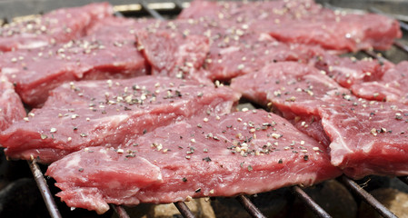 steaks on Barbecue grill almost raw