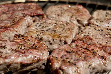 Steaks on  barbecue grill