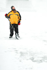 Fototapeta na wymiar Man shoveling snow