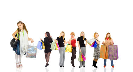 Fototapeta premium group of shoppers with little girl at front