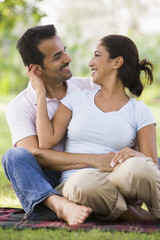 Couple relaxing in park