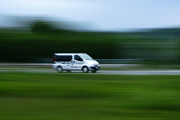 Delivery van moving on road