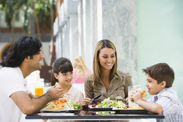 Family enjoying lunch at cafe