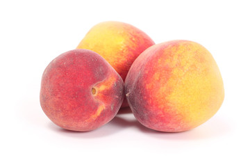 Three tasty juicy peaches