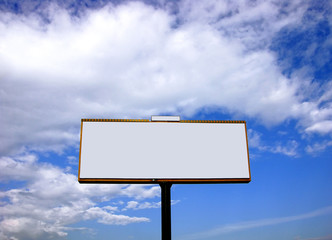 Blank white advertising billboard on blue sky with clouds