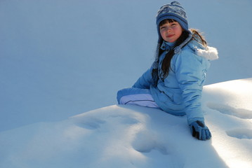 Girl sitting in snow