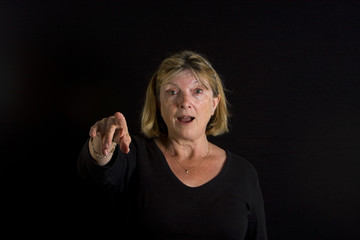 Senior Lady Pointing towards the Camera