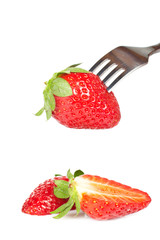 The fork pricking the strawberry
