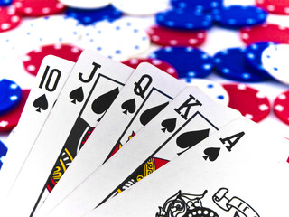 Red White and Blue Poker Chips and Royal Flush on White Backgrou