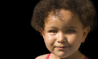Young black baby girl with curly hair
