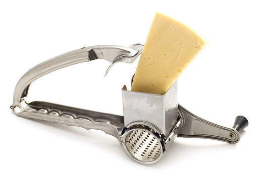 grater and cheese on white