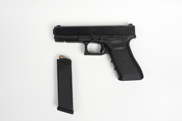 handgun with clip on white background