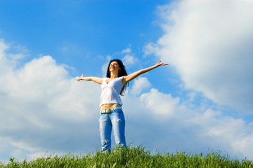 Naklejka premium happy young woman dreams to fly on winds