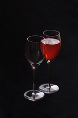 Wine glasses one with red