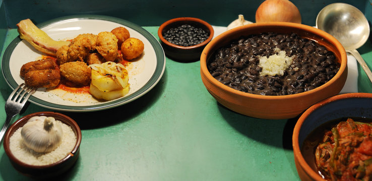 typical assorted cuban dishes over green surface