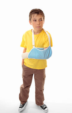 Hurt boy accident wearing an arm sling
