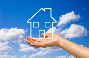 hand holding a home