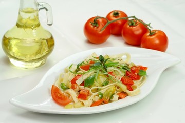 Spaghetti with vegetable,  olives, tomato  and olive oil