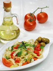 Spaghetti with vegetable,  olives, tomato  and olive oil