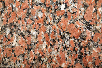 Red granite facing stone photographed close up